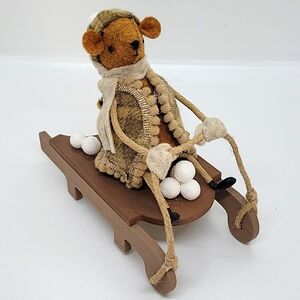 Felt bear on the sled